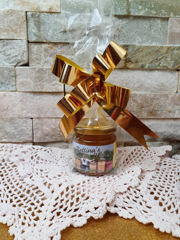 Honig mit goldener Schleife