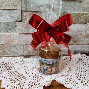 Honig mit roter Schleife